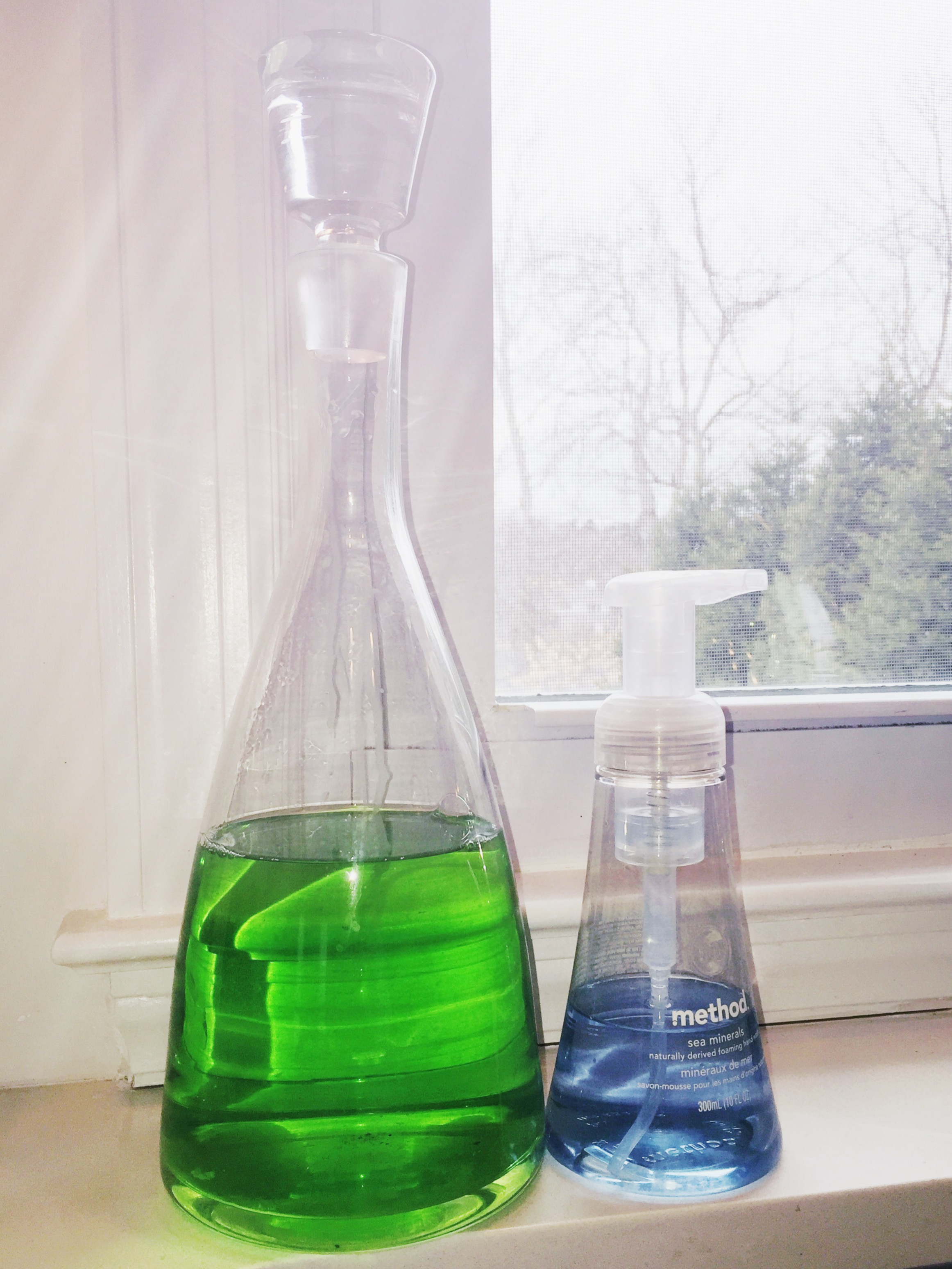 decanter as dish soap dispenser in Tiny Kelsie's bright &amp; kitschy kitchen