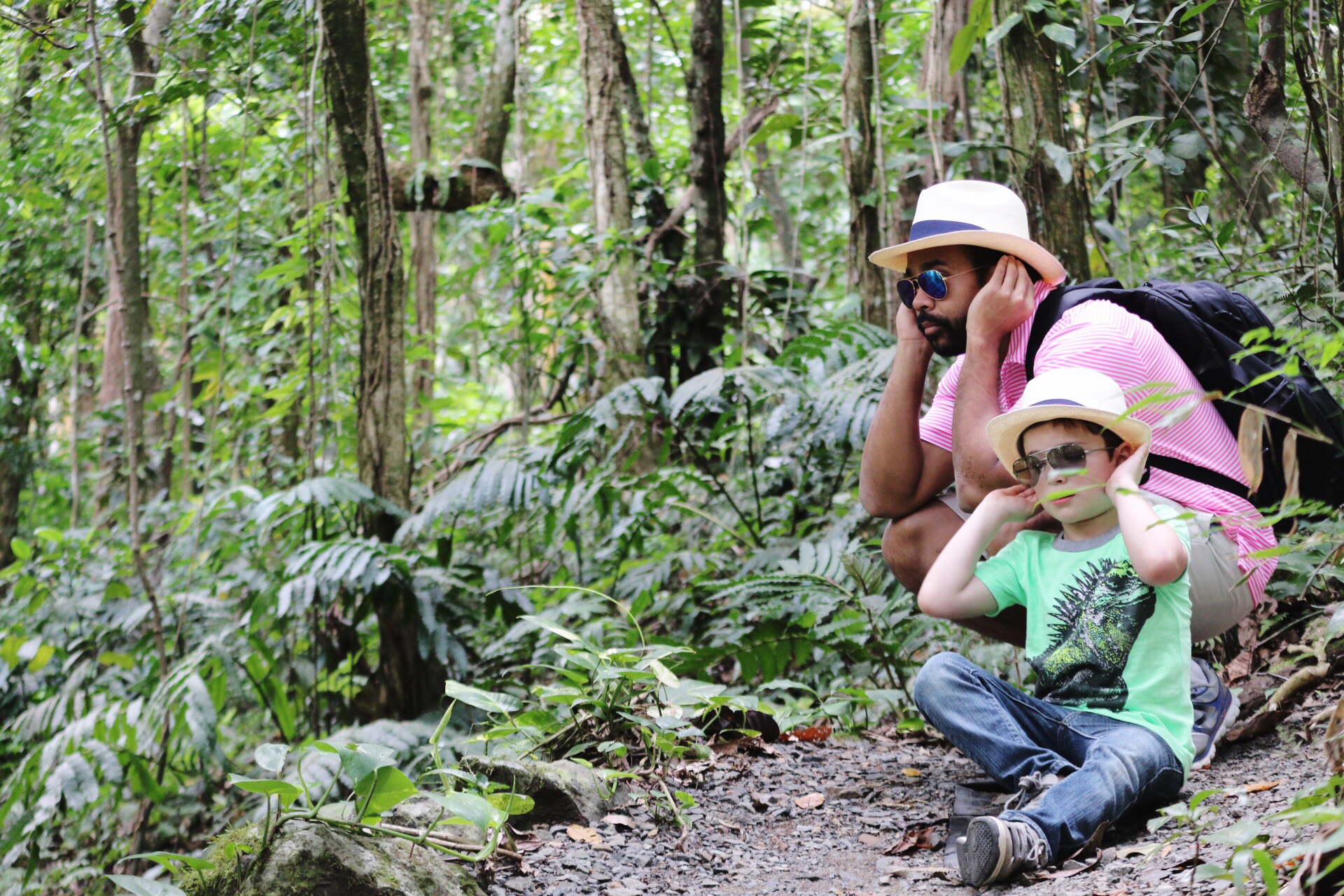 Father and son birdwatching in El Yunque National Forest Rainforest in Puerto Rico