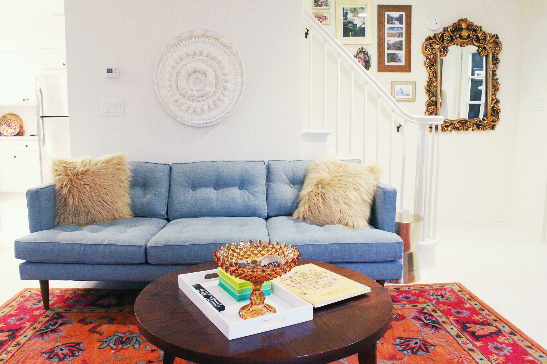 TinyKelsie living room progress with circle weave and mid century couch